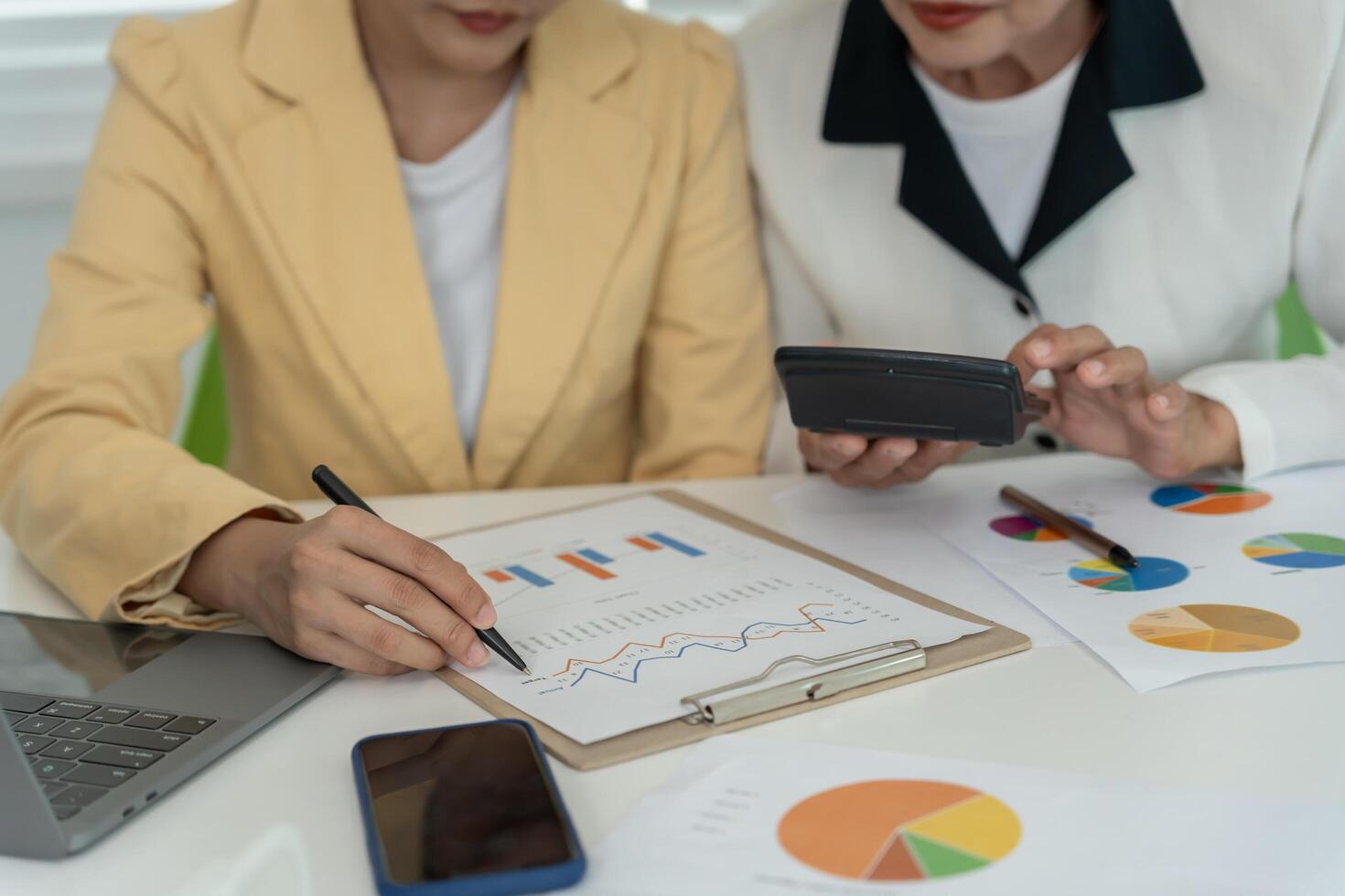 Business women calculate benefit, spreadsheets, graph financial development, bank accounts, statistics, economy, data analysis investment analysis, stock exchange,Interest rates, income photo