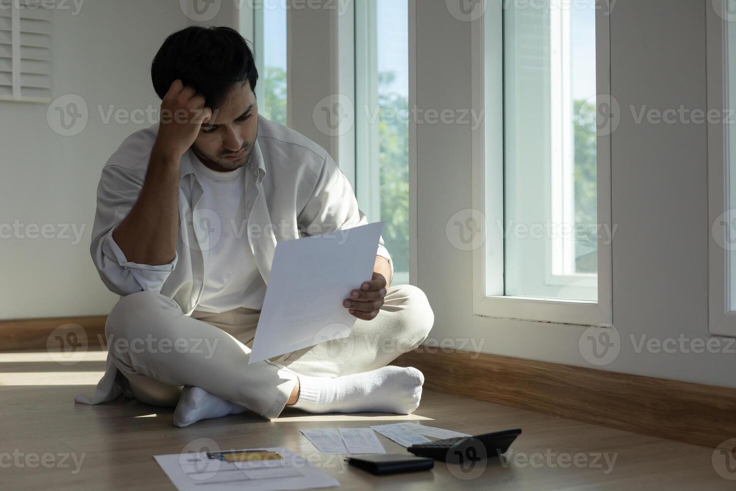 Stressed and headache man with large bills or invoices no money to pay to expenses and credit card debt. shortage, Financial problem, bankruptcy, mortgage, loan, bankrupt, poor empty wallet photo