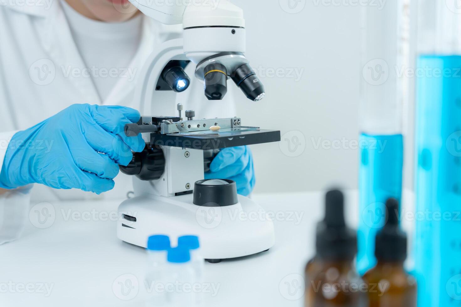 Scientist analyze biochemical samples in advanced scientific laboratory. Medical professional use microscope look microbiological developmental of viral, Biotechnology research in science lab. photo