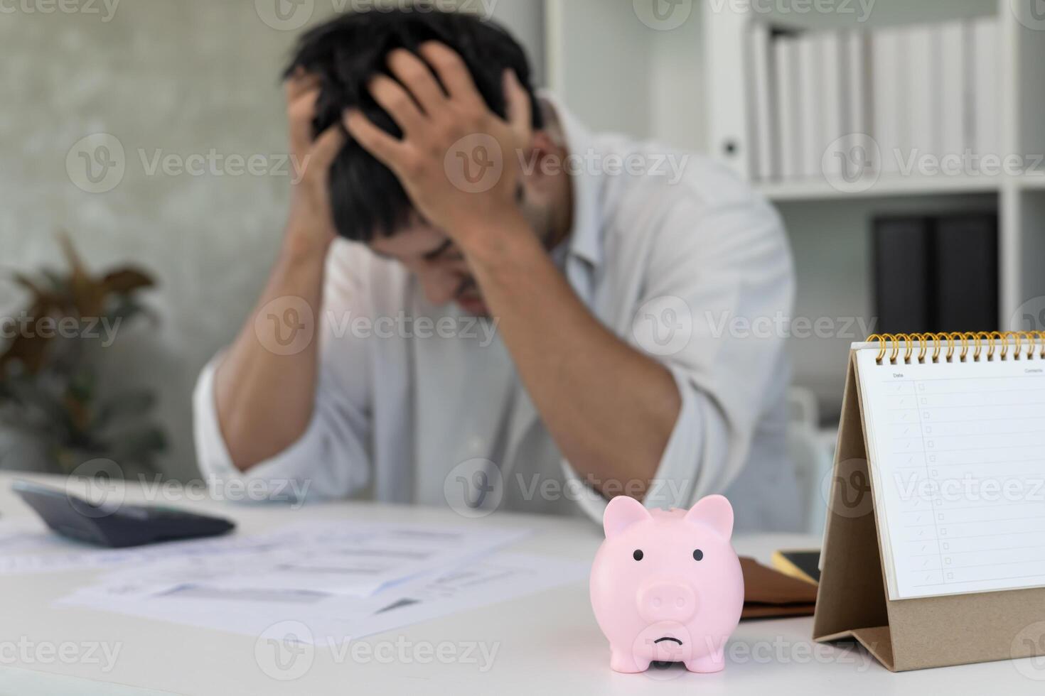 Stressed and headache asian man with large bills or invoices no money to pay to expenses and credit card debt. shortage, Financial problems, mortgage, loan, bankruptcy, bankrupt, poor empty wallet photo