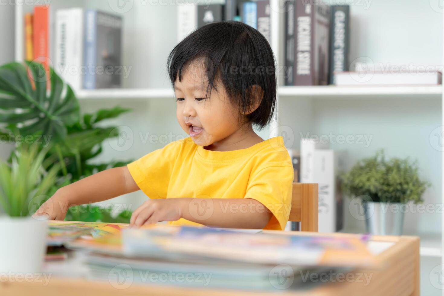 Asian children relax read book at home. daughter and reading a story. learn development, childcare, laughing, education, storytelling, practice, imagine reduce addiction mobile phone photo