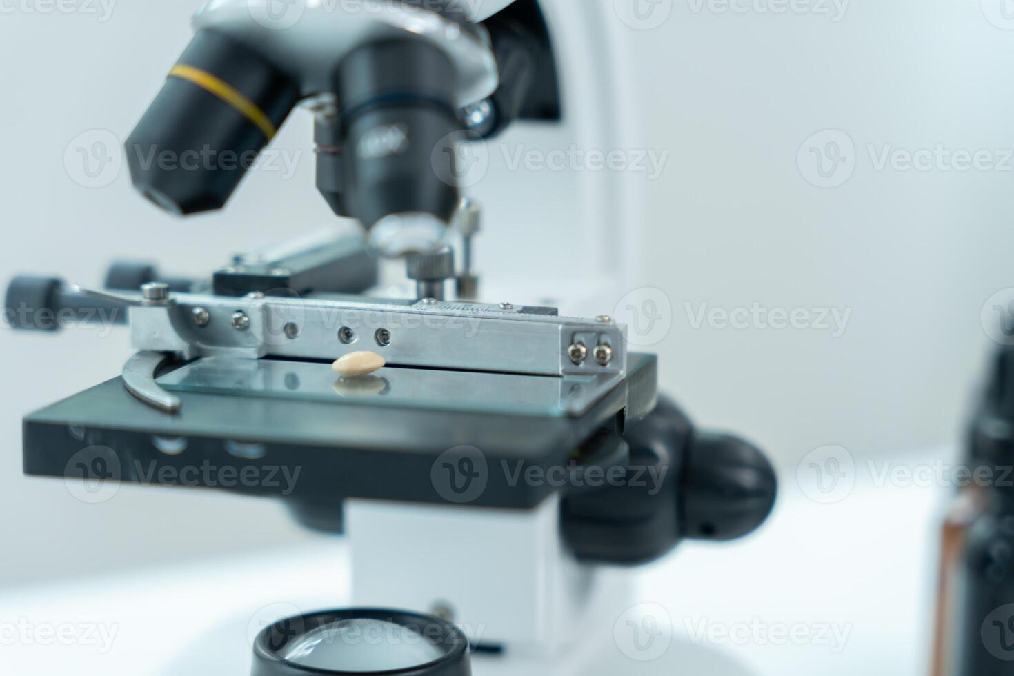 Scientist analyze biochemical samples in advanced scientific laboratory. Medical professional use microscope look microbiological developmental of viral Biotechnology research in science lab, photo