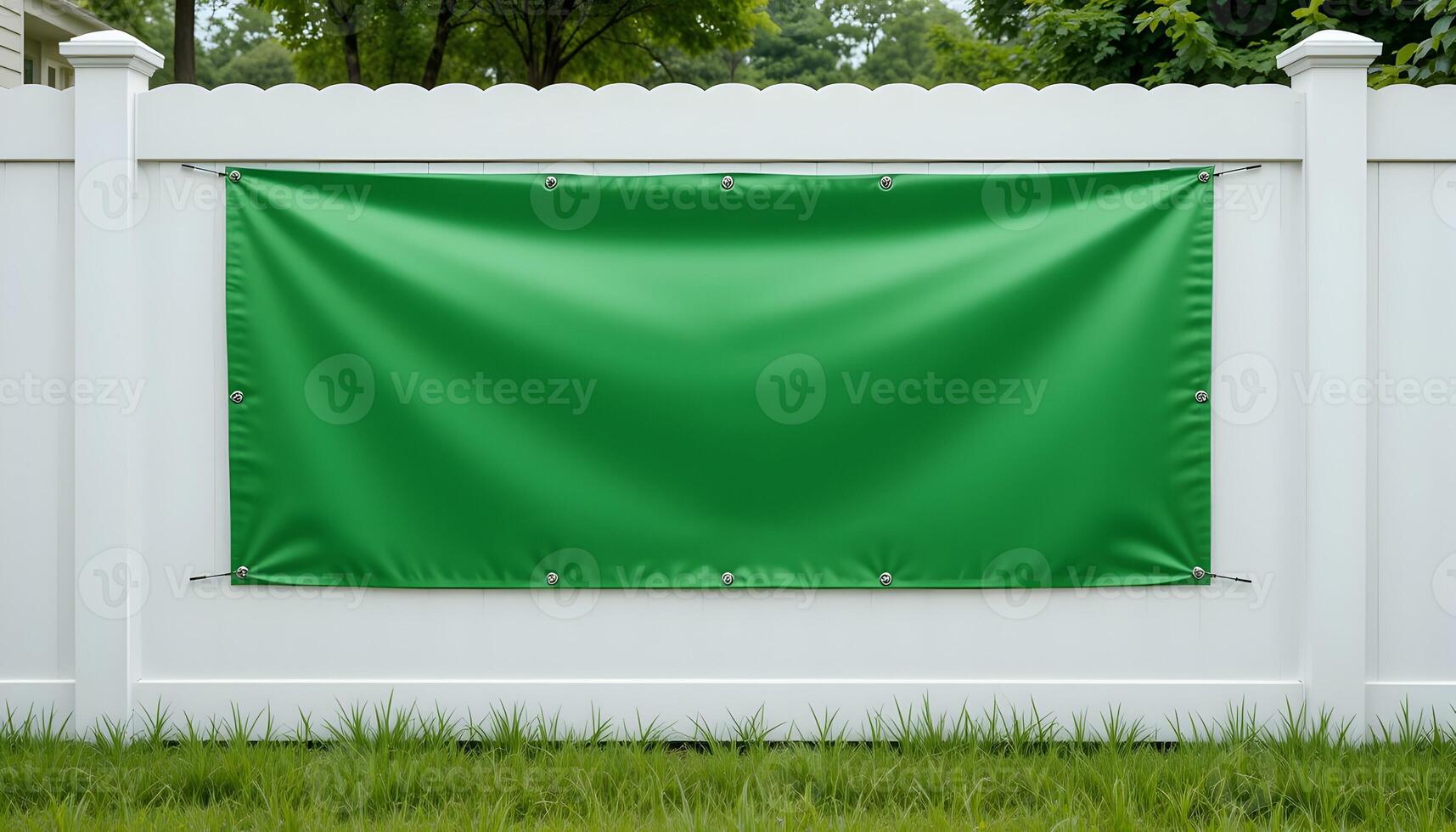 Green Banner Hanging on White Fence Creates Outdoor Advertisement Space photo