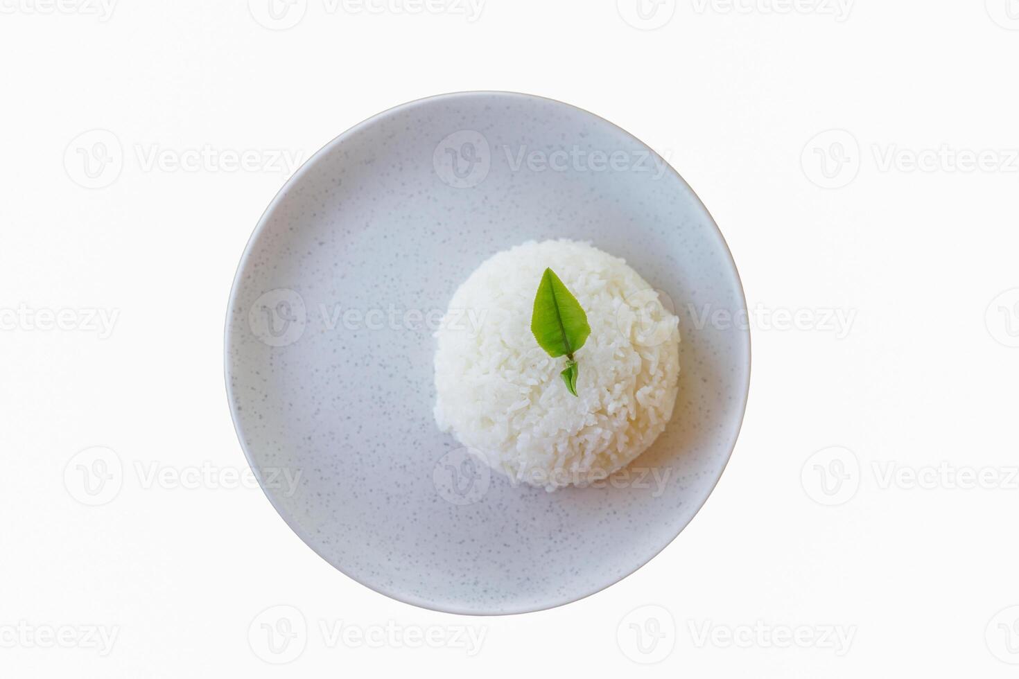 Rice on a white ceramic plate with empty space for design work. Soft and selective focus photo