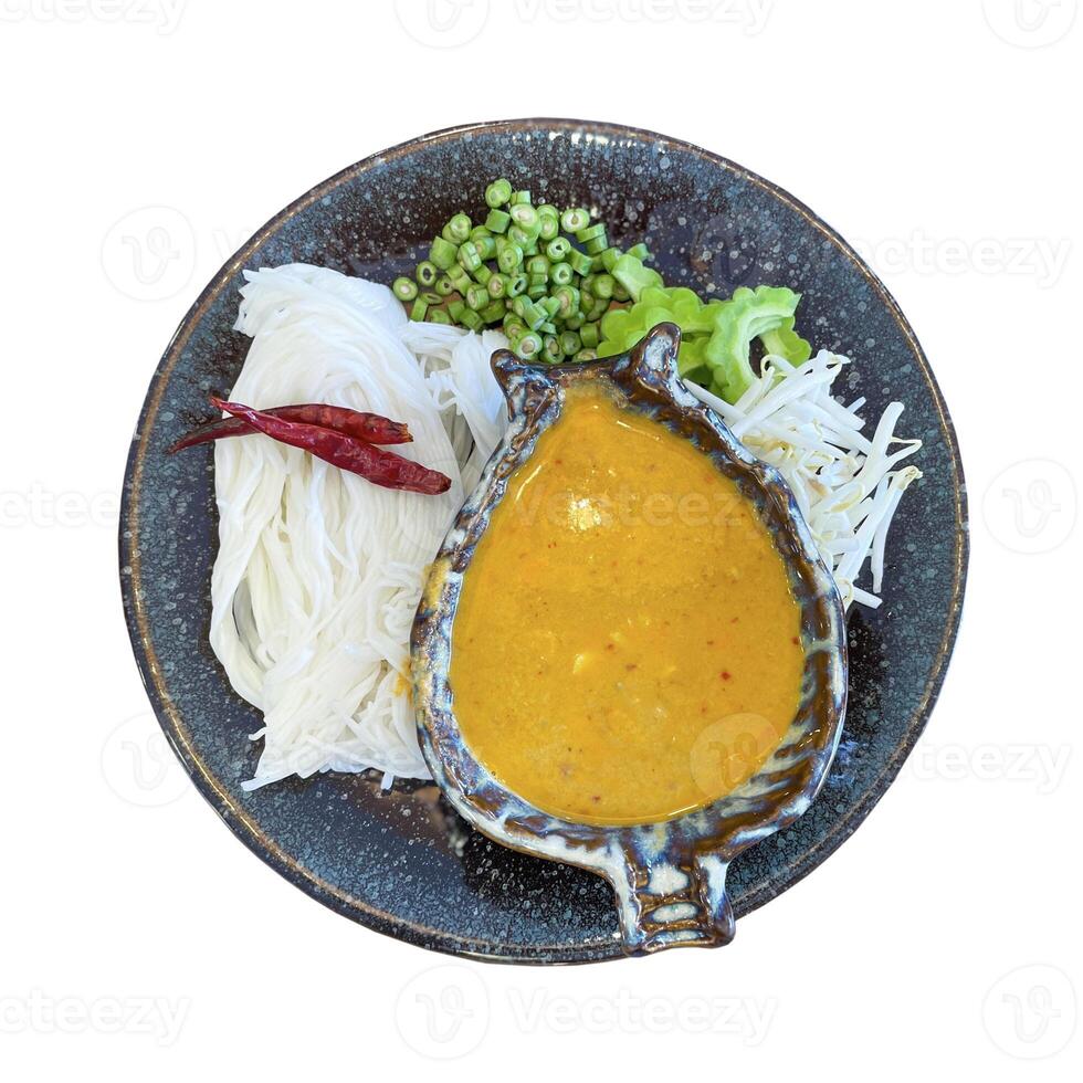 isolated top view of Thai Rice Noodles in Fish Curry Sauce dish on white background. soft and selective focus. photo