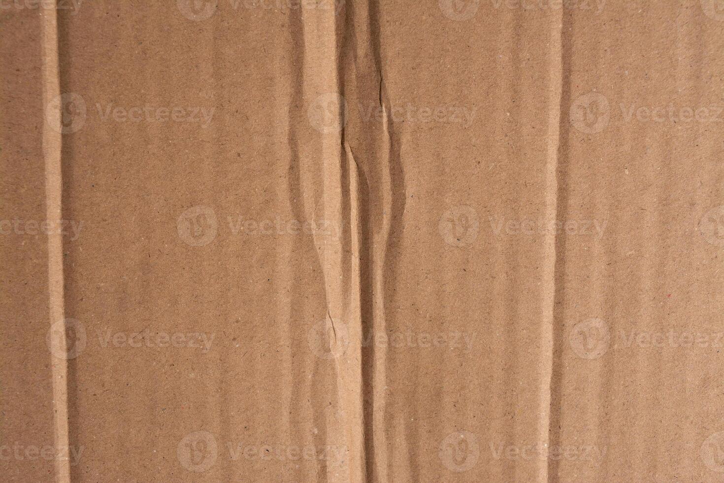Beige cardboard texture. Crumpled cardboard. Copy space. photo