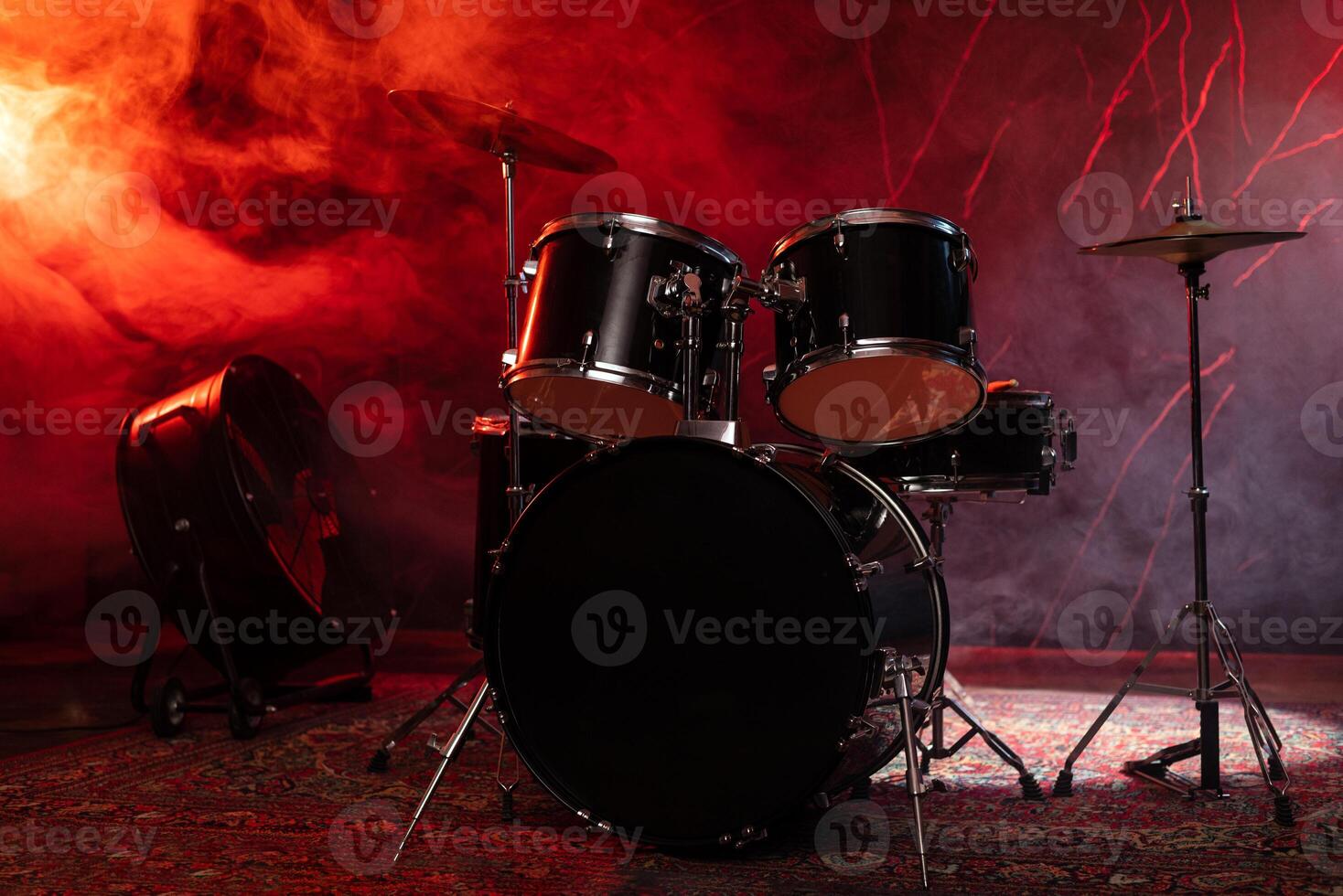 Drums and drum set. Beautiful blue and red background, with rays of light. Beautiful special effects of smoke and lighting. Musical instrument. The concept of music. Close-up photo. photo