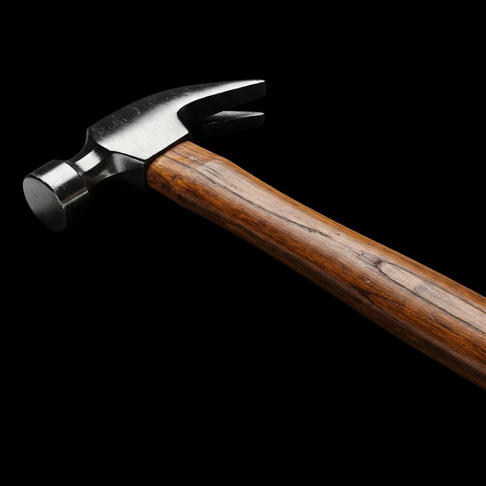 A hammer with a wooden handle on a black background photo