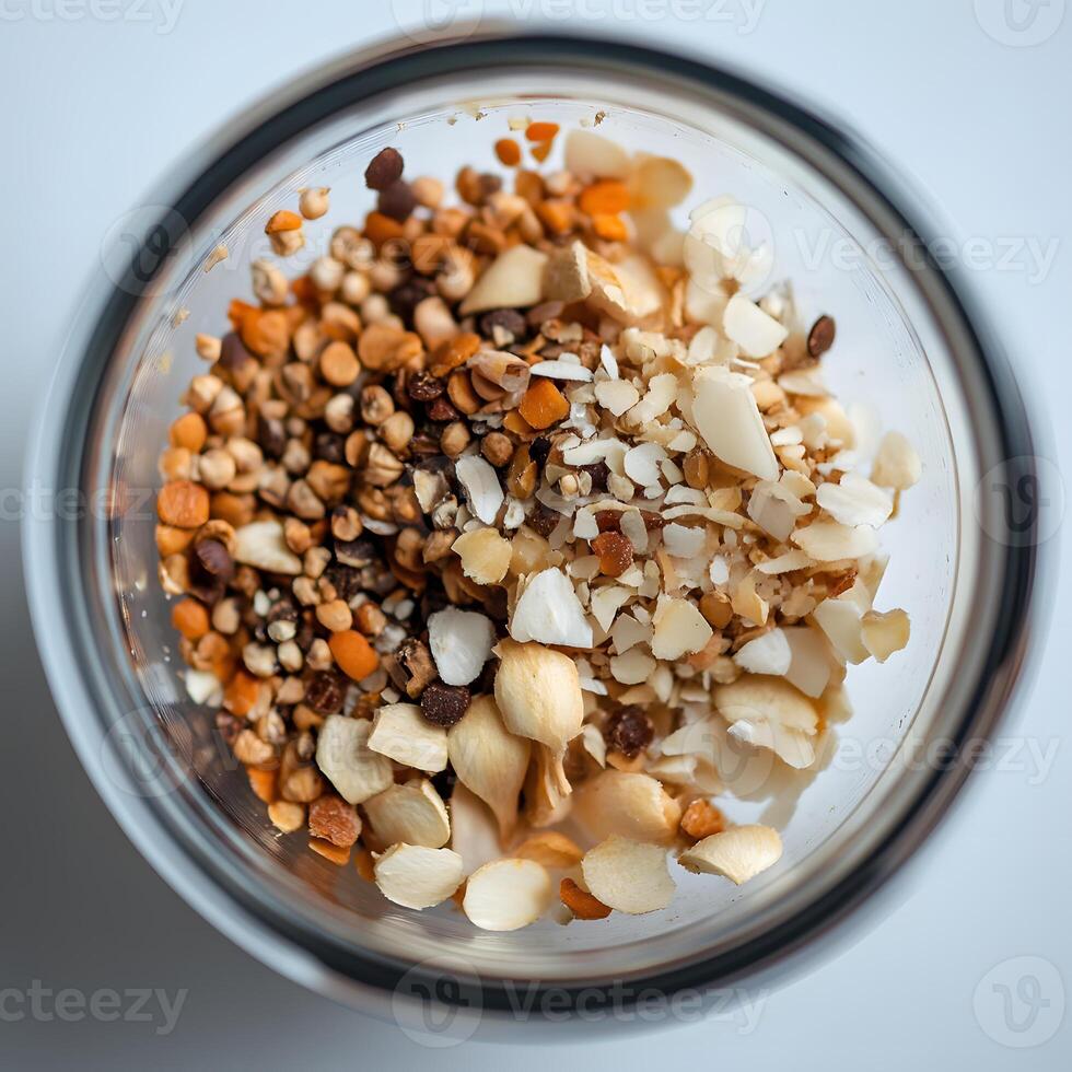 dried herbs and spices. Mix of nuts and seeds in a glass on a white background. photo