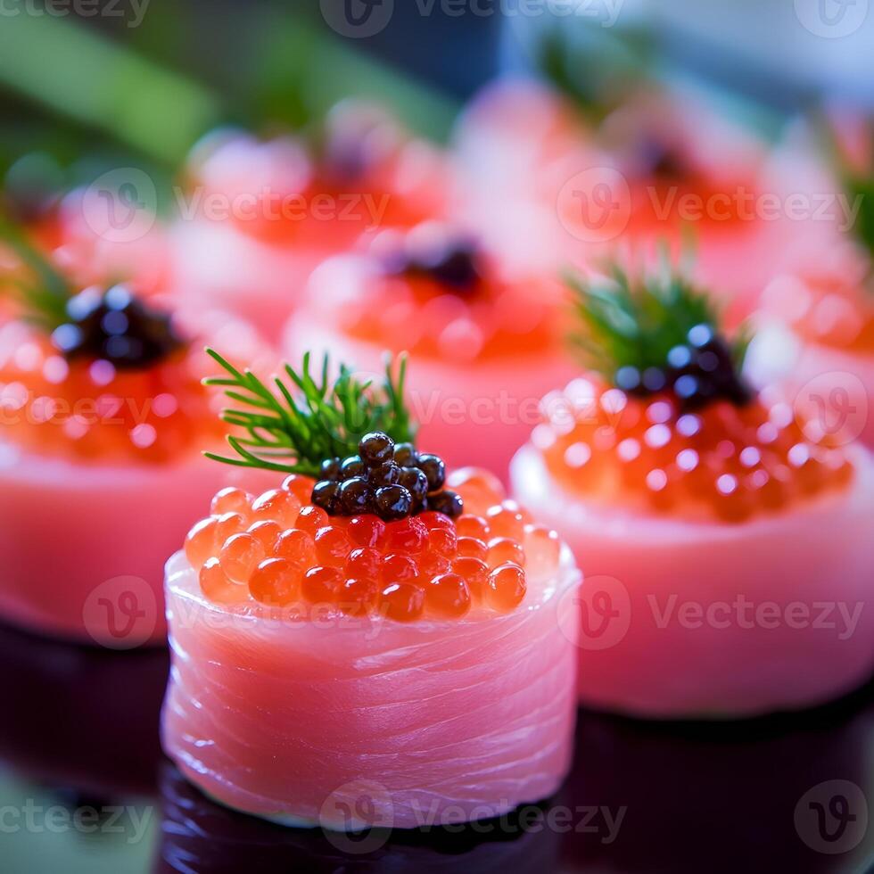 Closeup of sushi rolls with salmon and caviar on black background. Pink food. selective focus. photo