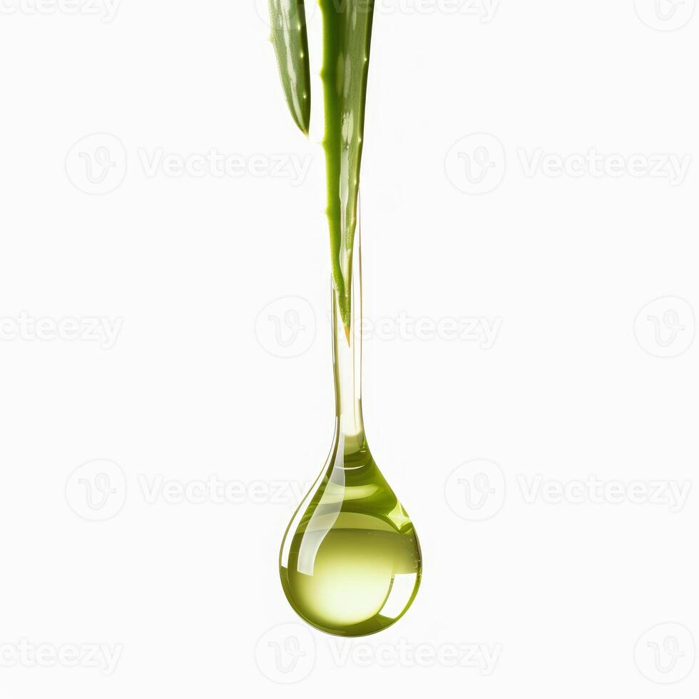 Aloe vera leaf dripping essential oil into a drop on white background photo