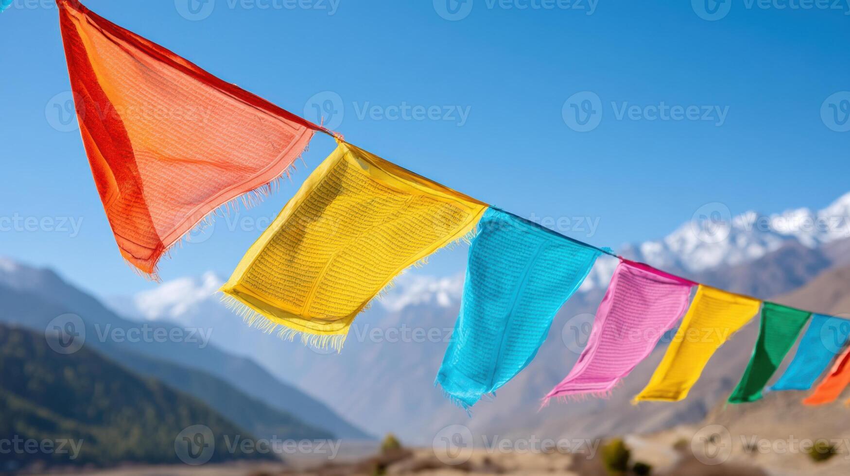 Colorful prayer flags fluttering in the wind in the Himalayas photo