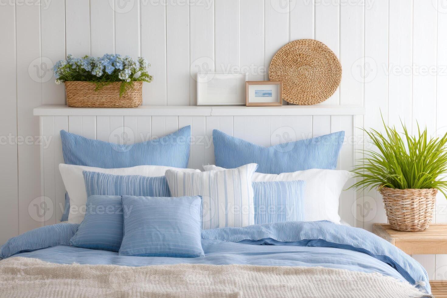 Cozy bedroom interior featuring a soft blue color palette with decorative pillows, a woven basket, and fresh flowers creating a serene and inviting atmosphere for relaxation photo