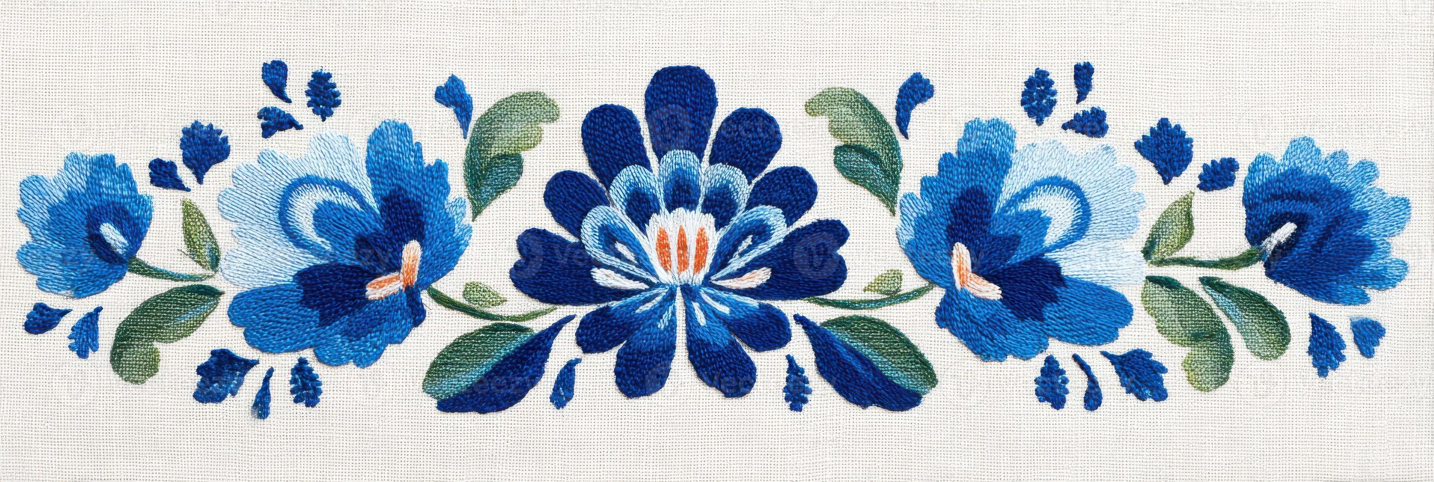 Embroidered linen panel with traditional Russian floral ornament representing blue flowers photo