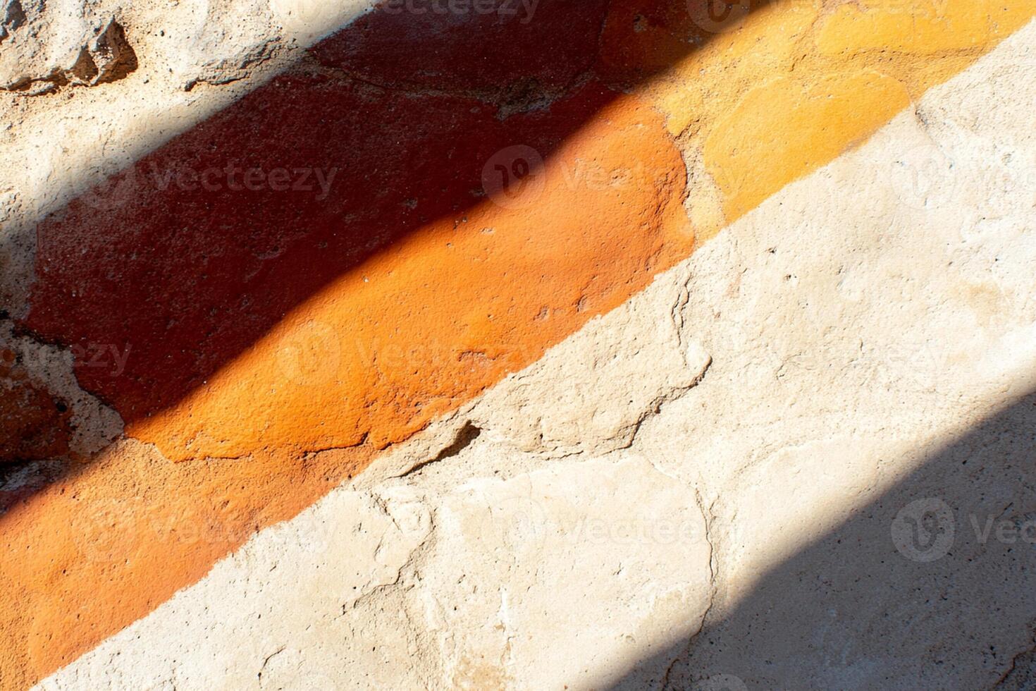 A wall with a red and orange stripe photo