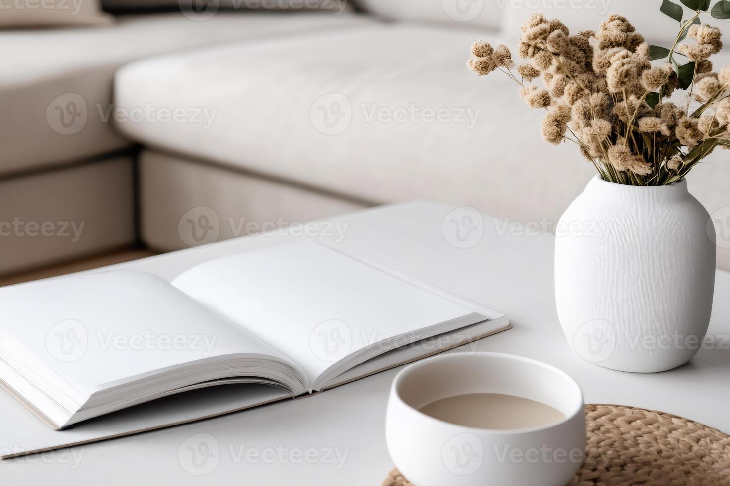 Open notebook, dried flowers, and a cup of coffee creating a cozy atmosphere on a coffee table photo