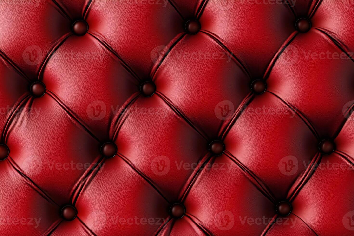 Luxurious red leather upholstery forming a diamond pattern with buttons photo