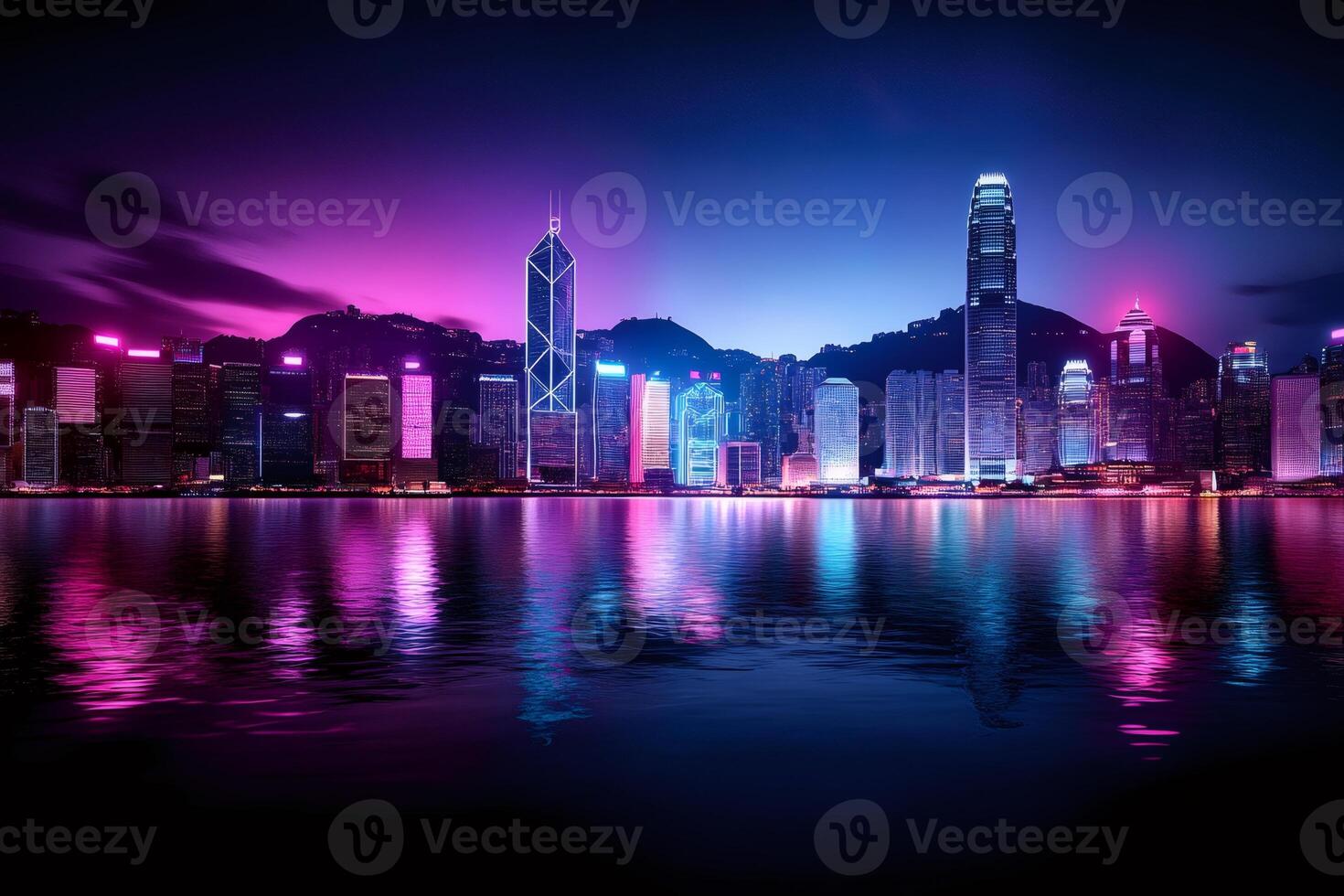 Hong kong skyline reflecting in water at night with purple and blue lights photo