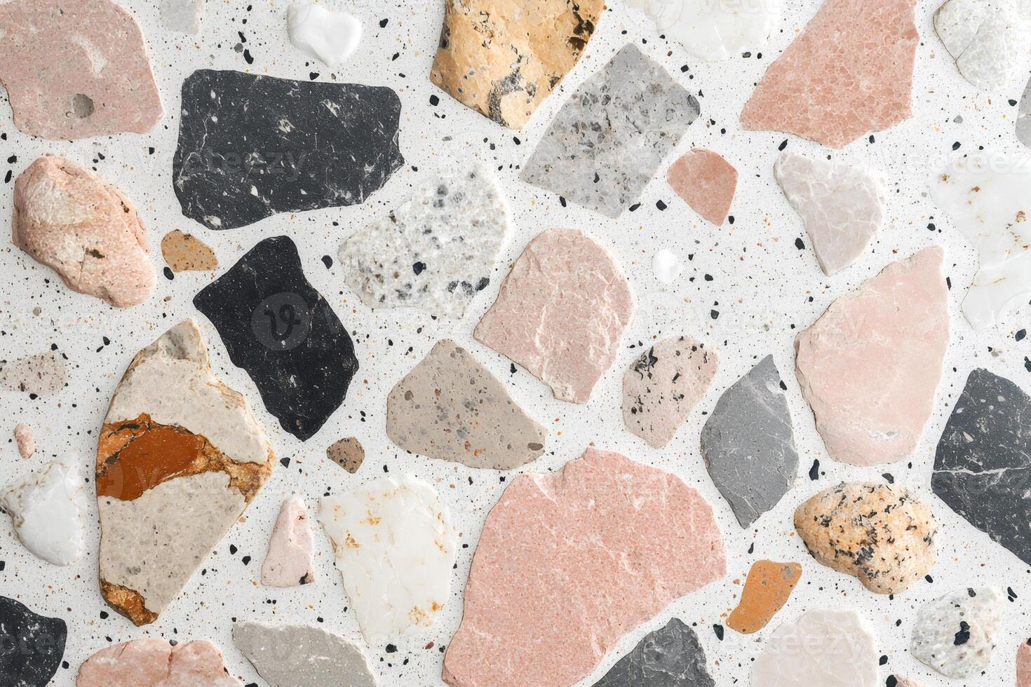 Terrazzo flooring showing colorful stone fragments embedded in concrete photo