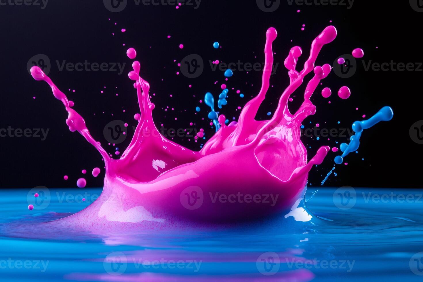Pink and blue paint splashing in water creating crown shape photo