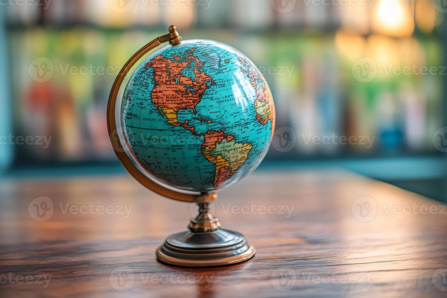Vintage globe showing america on wooden table in blurred bookshelf background photo