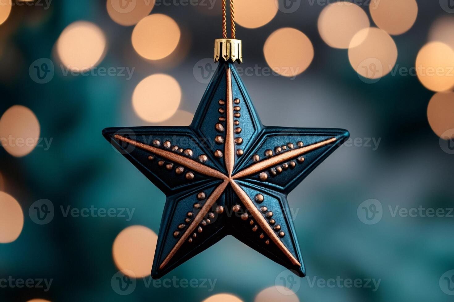 Christmas star ornament hanging with blurred lights in background photo