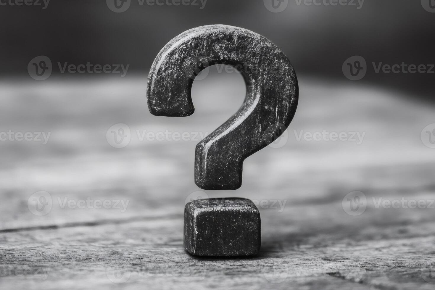 Large wooden question mark stands on rustic surface representing uncertainty photo