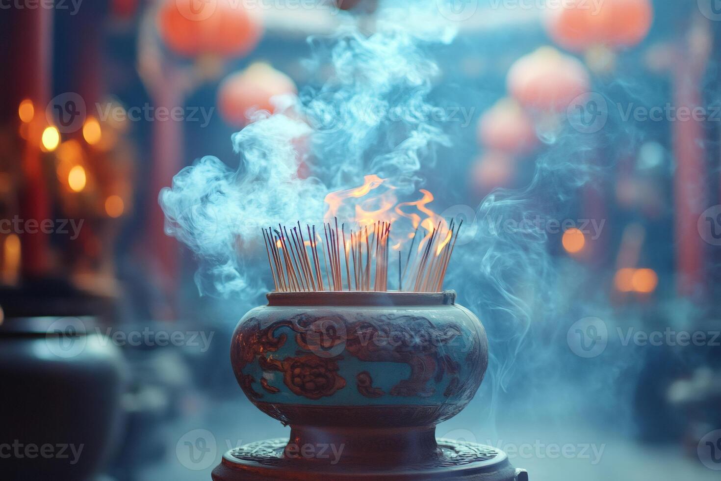 Incense burning in ornate censer creating a mystical atmosphere in temple photo