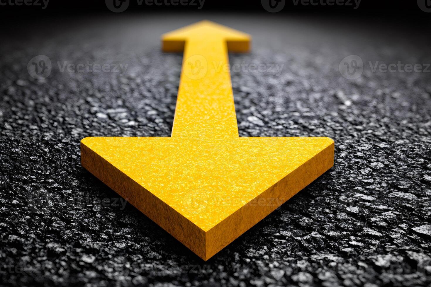 Double yellow arrow is pointing in opposite directions on asphalt road photo