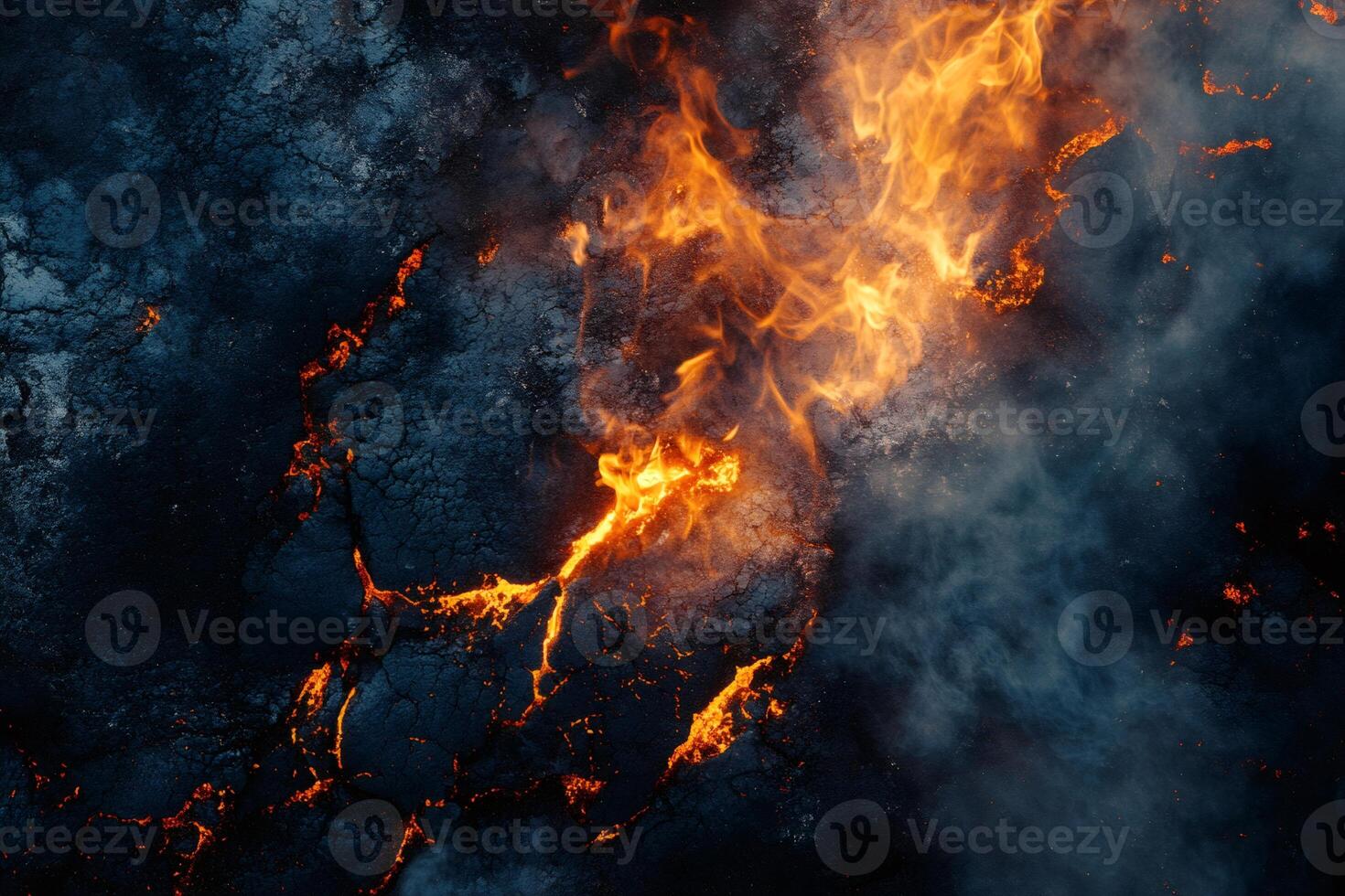 Burning asphalt road erupting in flames and smoke photo