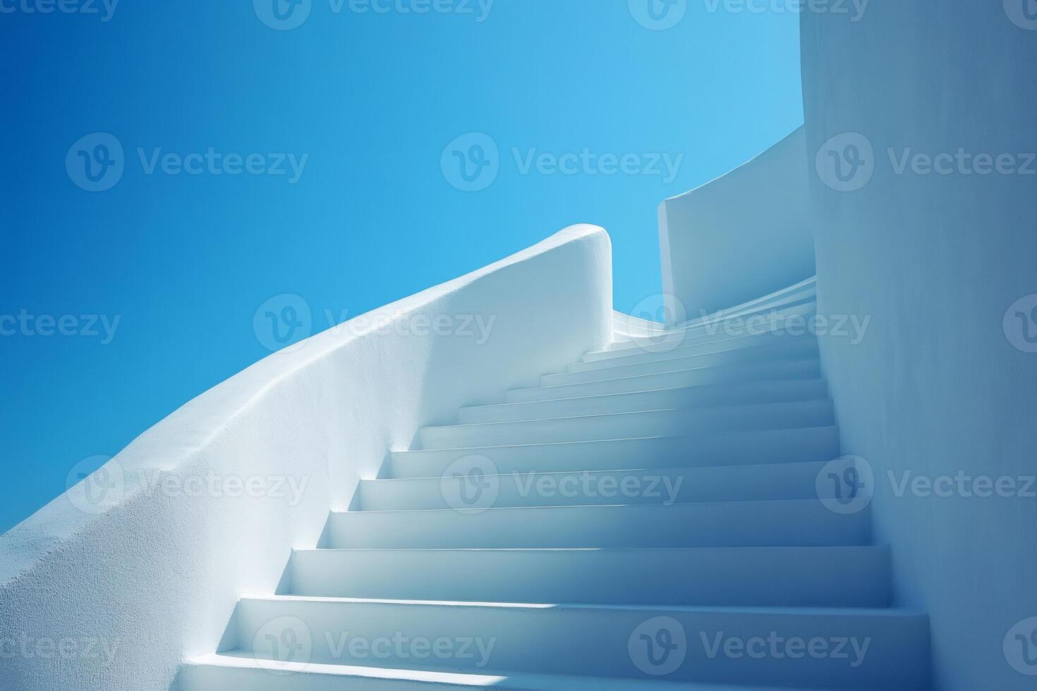 Whitewashed staircase ascending under blue sky in santorini, greece photo