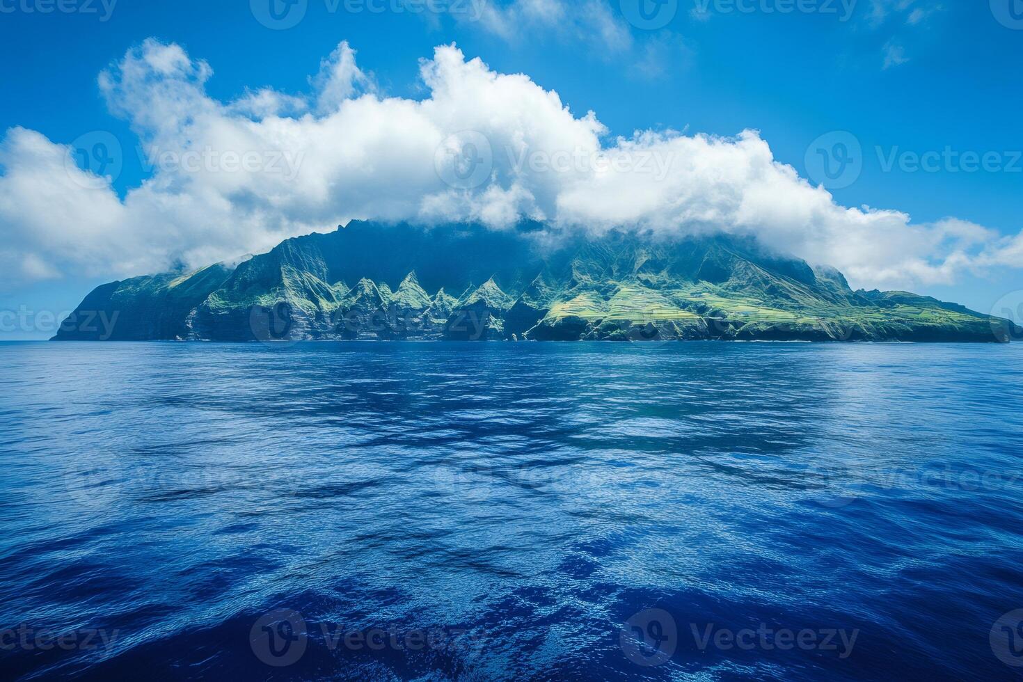 Majestic island emerging from the deep blue sea under a cloudy sky photo