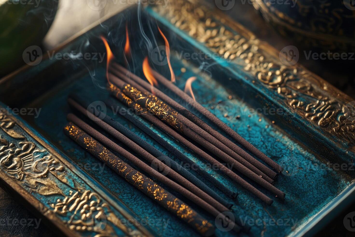 Burning incense sticks smoldering in ornate bowl with smoke. photo