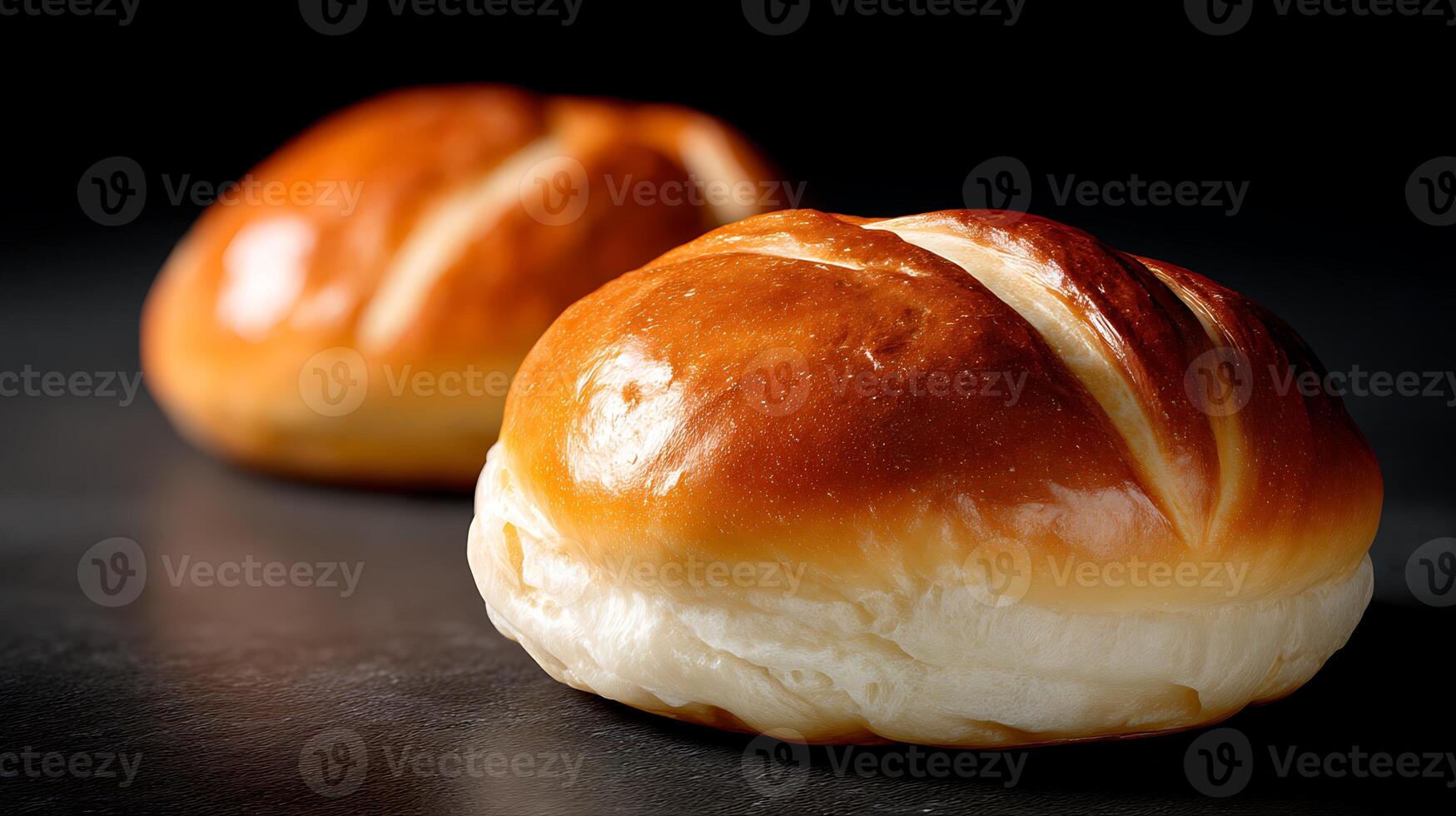 Two buns sitting on a table photo