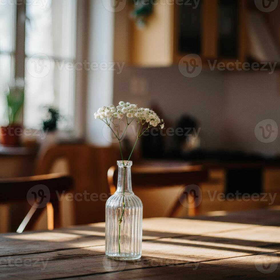 Elegant babys breath flowers in frosted glass vase glowing in warm ambient light cozy romantic interior floral decor photo