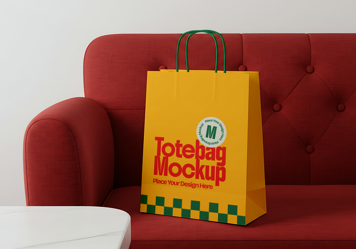 A yellow tote bag mockup sits on a red couch psd