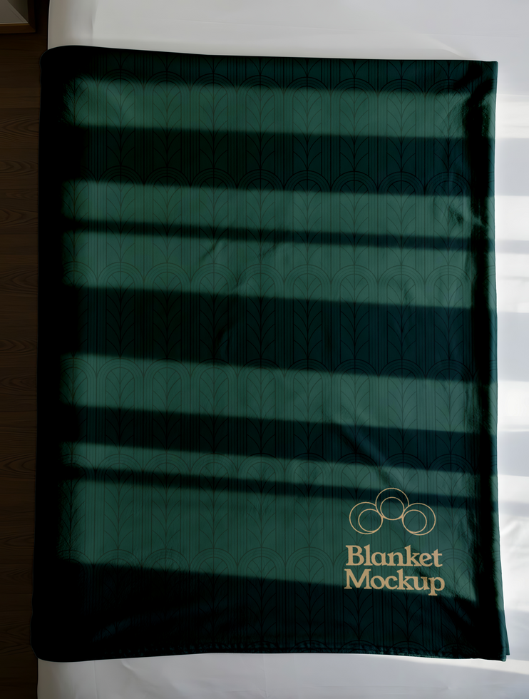 A dark green blanket with a subtle patterned design and Blanket Mockup subtly printed on it psd
