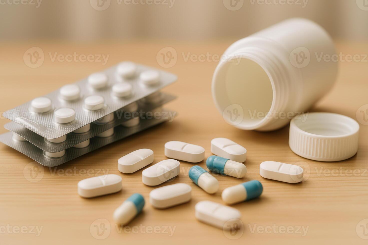 Assorted pills including tablets and capsules are displayed beside an open white bottle and blister packs on a wooden surface. Pharmaceutical visuals, healthcare content, and product presentations. photo