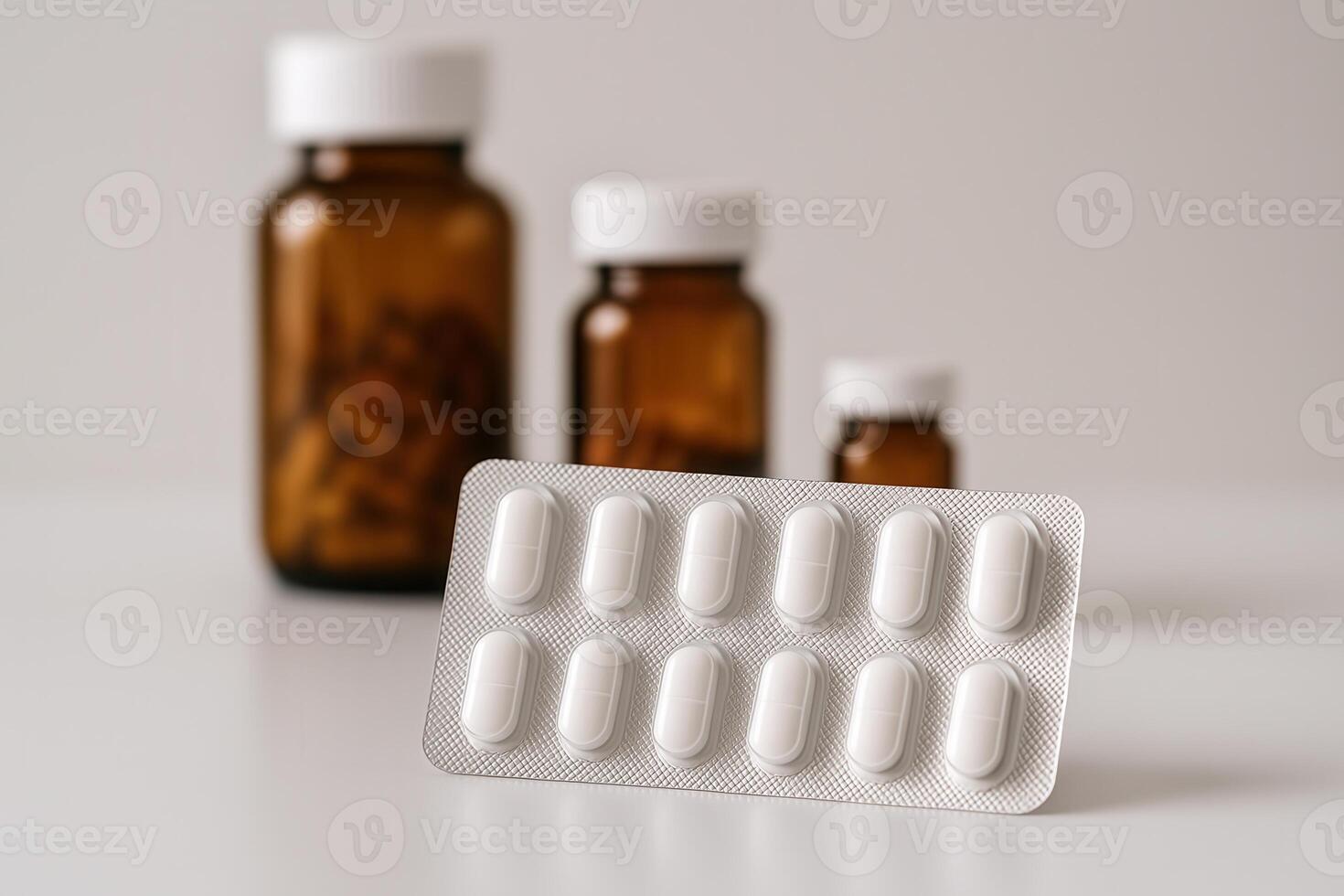 White pills in a blister pack with amber prescription bottles softly blurred in the background. A clean, professional composition for healthcare, pharmacy, or medication-related content. photo