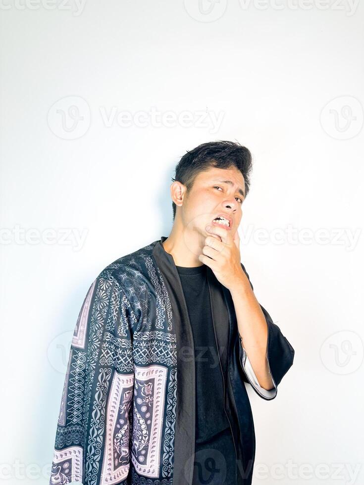 A man in a black shirt and a patterned jacket photo