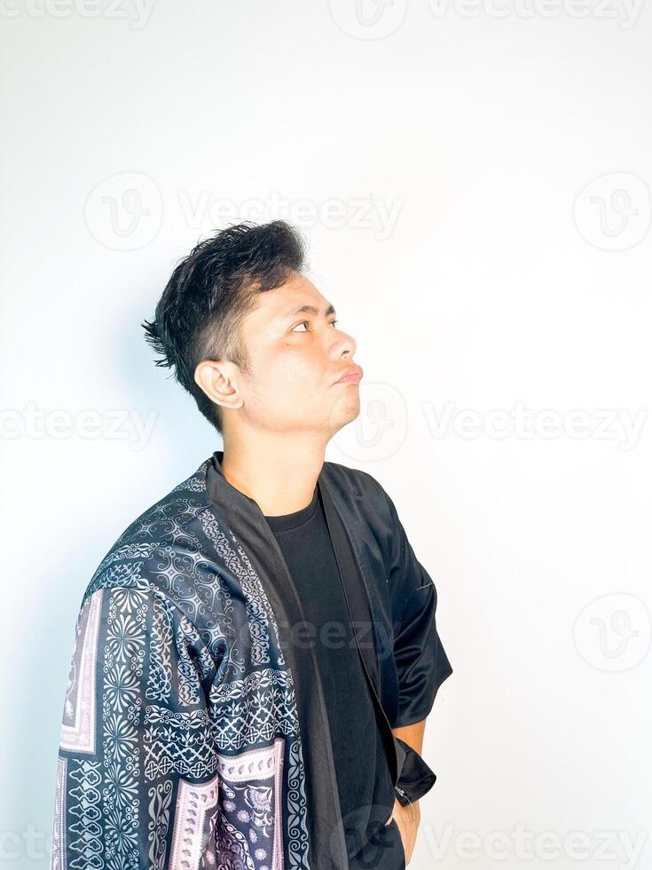A man wearing a kimono jacket and black shirt photo