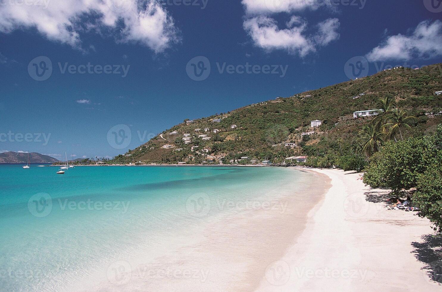 A beach with white sand and blue water 11 photo