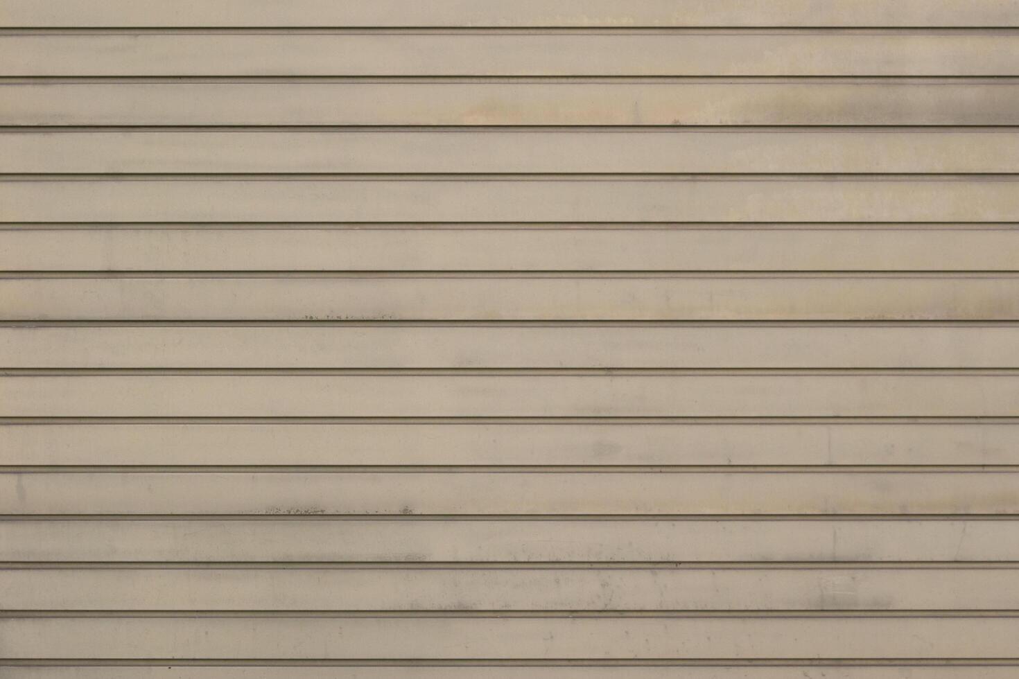 A close up of a wall with a few lines of paint photo