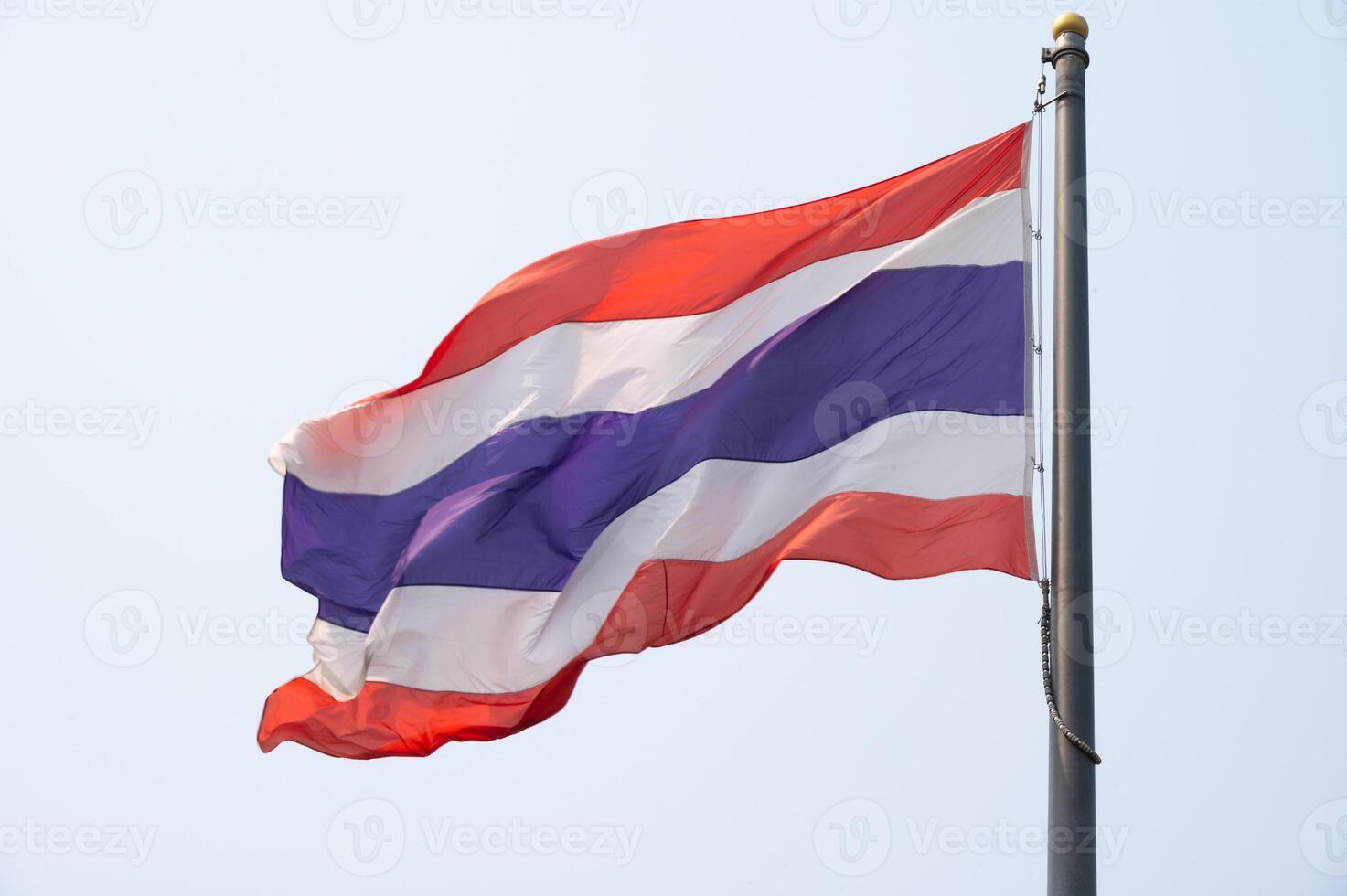 A Thailand national flag blowing by wind. photo