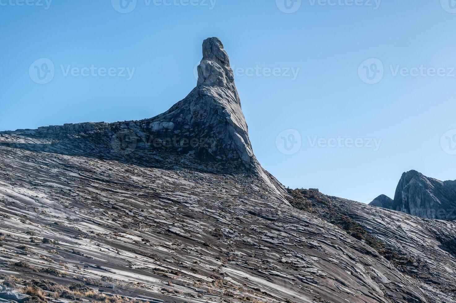 Granite plateau on Mt.Kinabalu with an iconic Donkey's Ear Peak. photo