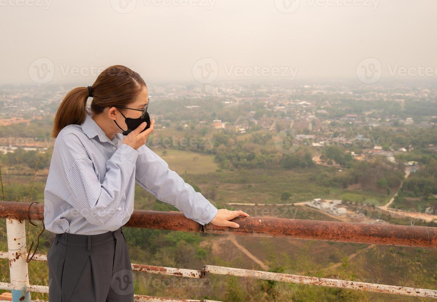 Asian businesswoman coughing becaused of allergy from Bad air pollution. photo