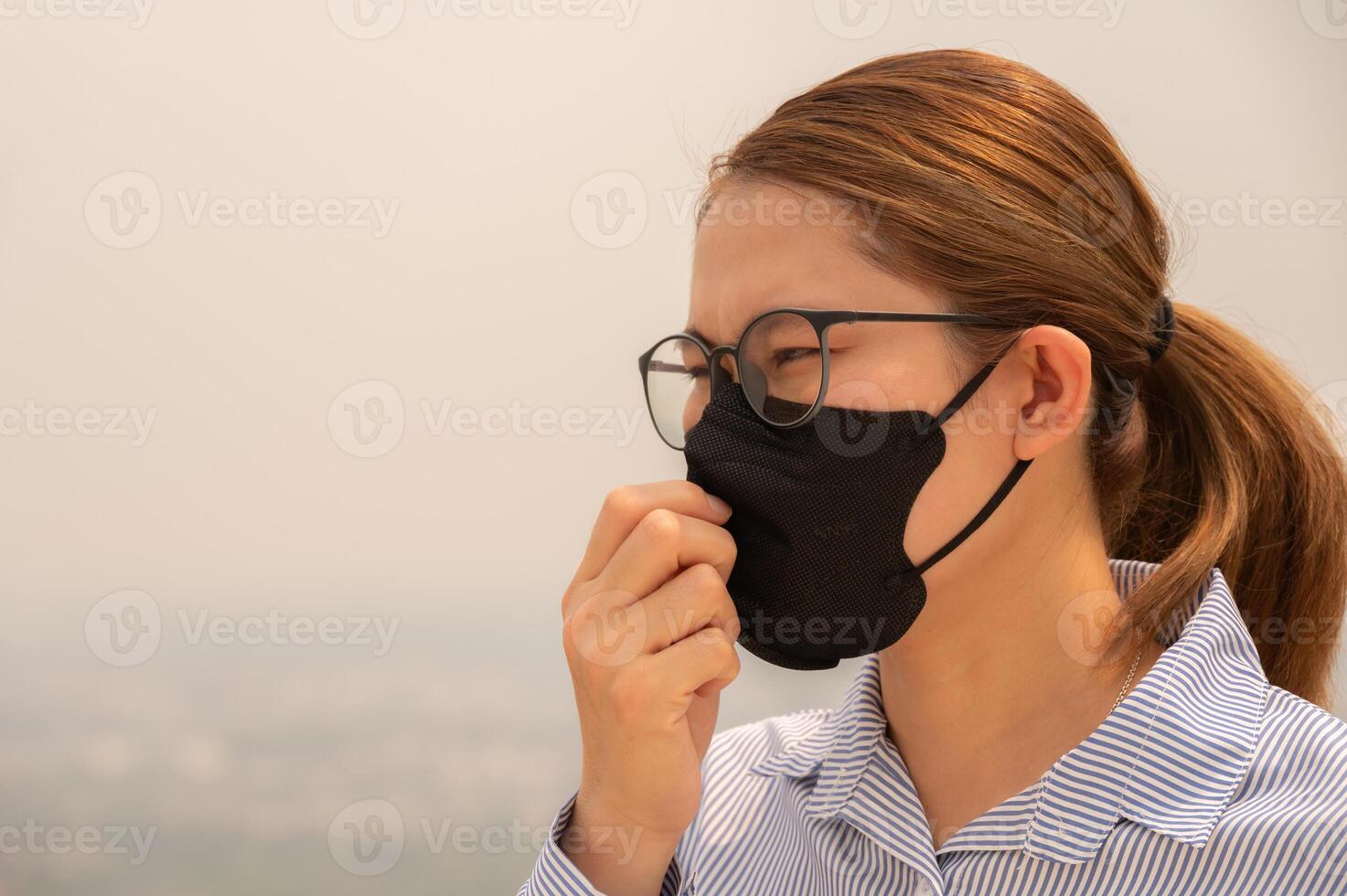 Businesswoman coughing becaused of allergy from Bad air pollution. photo