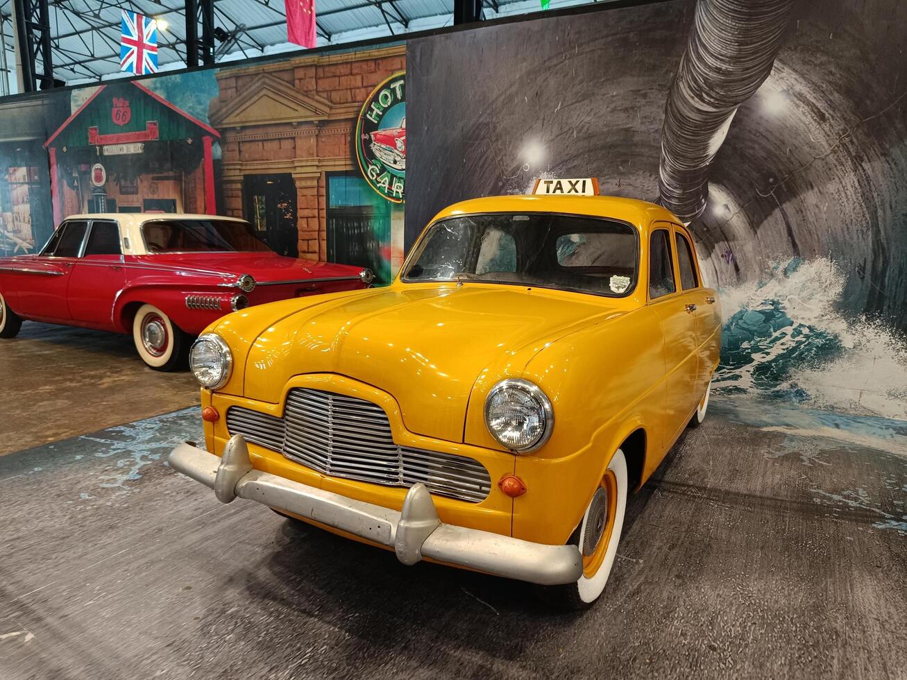 solo, central java - indonesia, april 22, 2025, Vintage Yellow Taxi Car in Dramatic Tunnel Scene photo