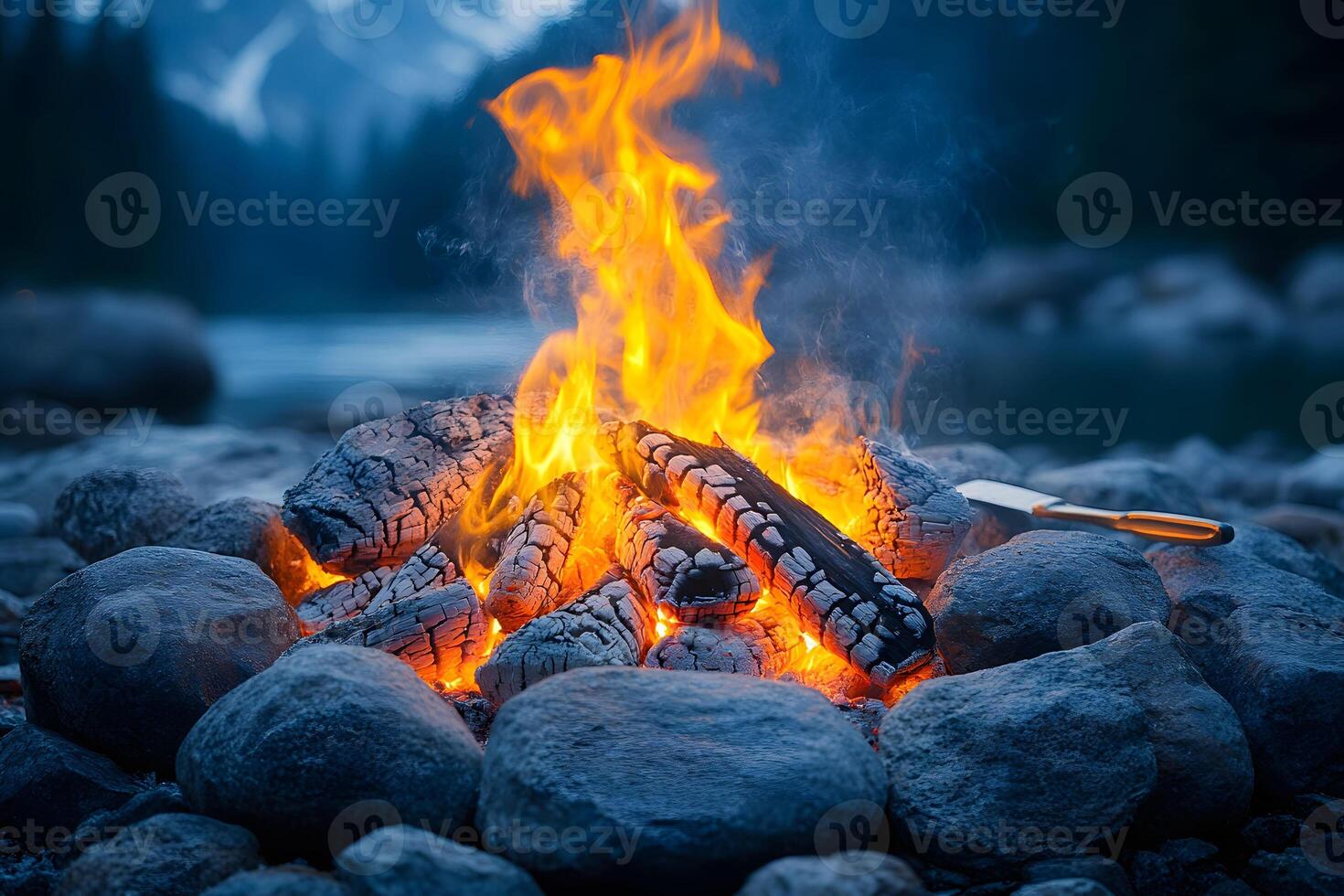 Cozy Mountain Lakeside Campfire with Roaring Flames for Outdoor Adventure and Camping Retreat photo