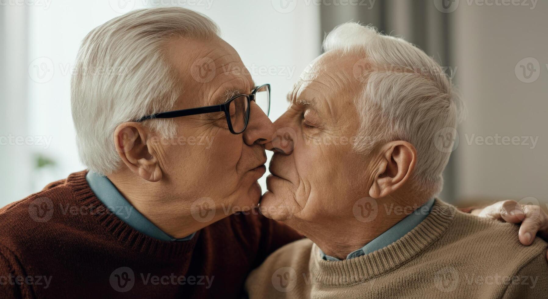 Elderly caucasian male couple sharing intimate moment at home for love and companionship concepts photo
